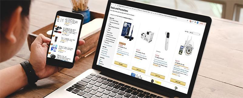 Customer shopping across a laptop and mobile phone